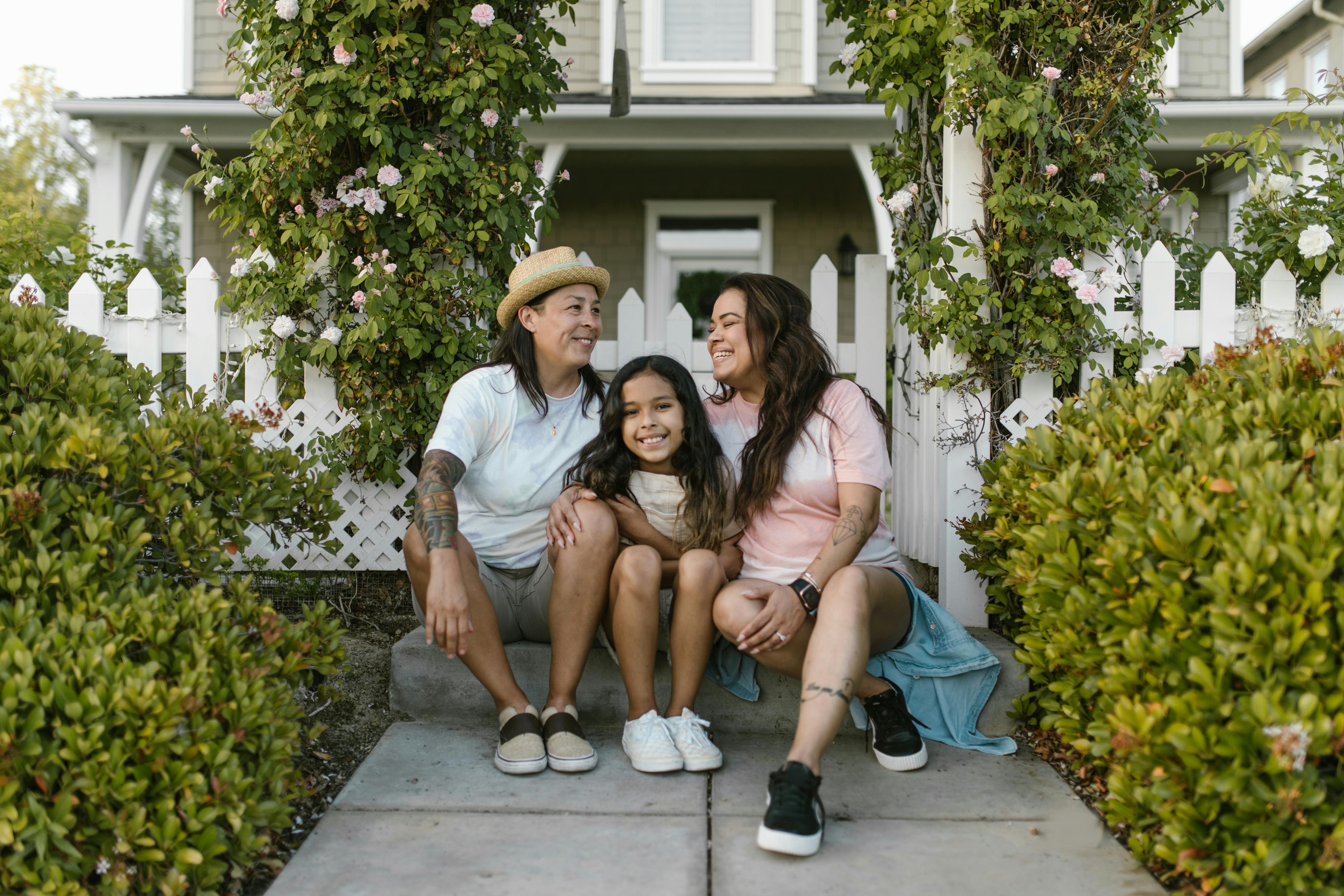 Happy family in front of a welcoming home